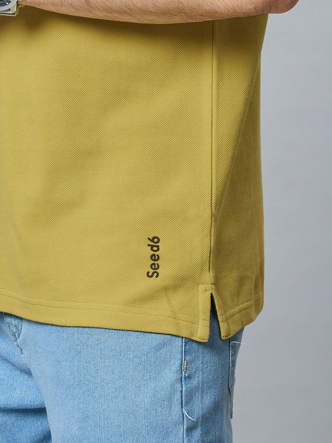 The Jacquard Polo in Mehandi with Navy