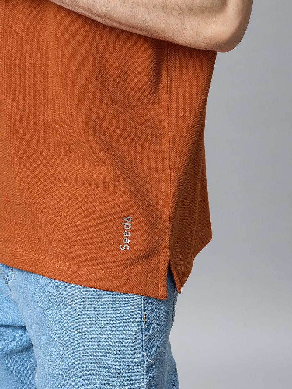 The Jacquard Polo in Rust with Navy